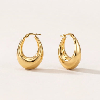 Luna Drop Hoops: hypoallergenic hoop earrings, shown front and side on a soft stone background