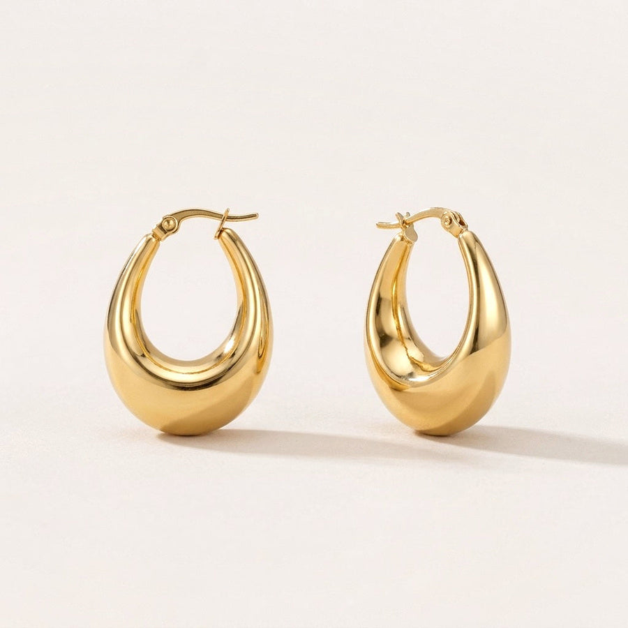 Luna Drop Hoops: hypoallergenic hoop earrings, shown front and side on a soft stone background