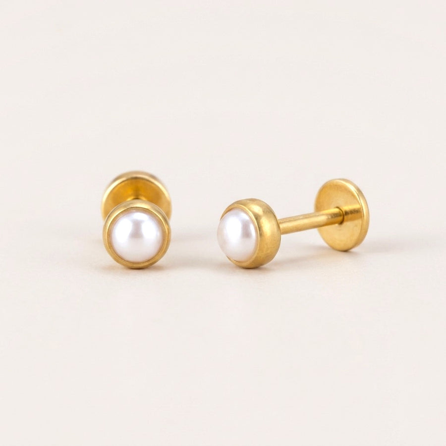 Pearl Bezel Flat Back Studs Gold: hypoallergenic kids' flat back stud earrings, shown front and side on a soft stone background