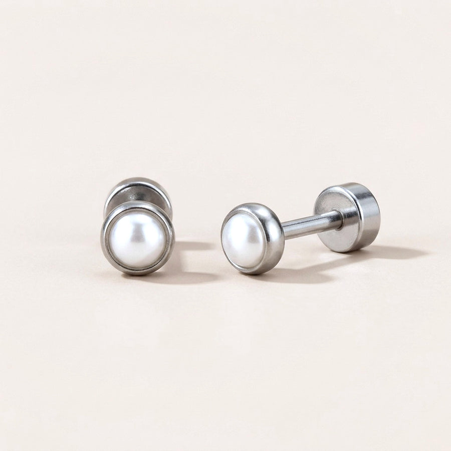 Pearl Bezel Flat Back Studs Silver: hypoallergenic kids' flat back stud earrings, shown front and side on a soft stone background