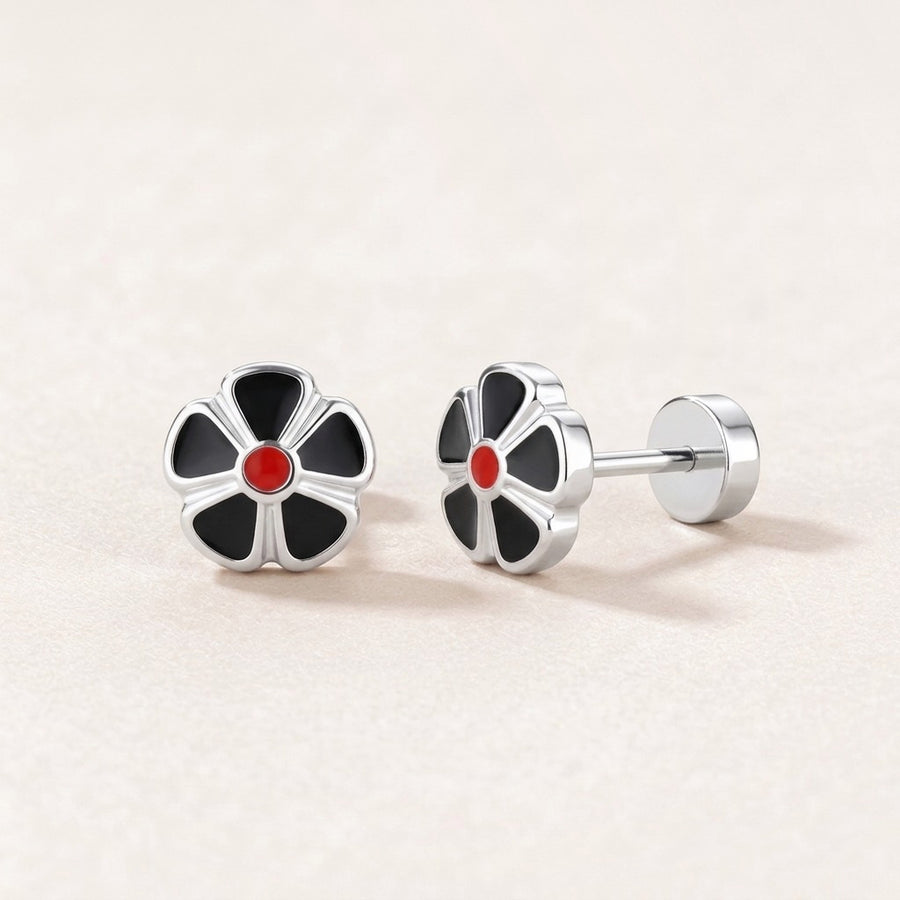 Petal Flower Flat Back Studs Silver in Black: hypoallergenic kids' flat back stud earrings, shown front and side on a soft stone background