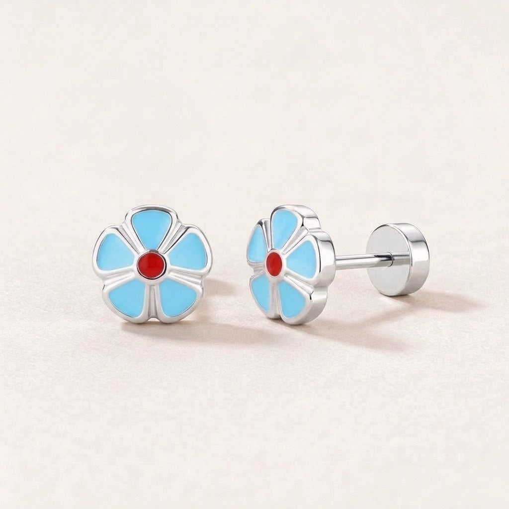 Petal Flower Flat Back Studs Silver in Light Blue: hypoallergenic kids' flat back stud earrings, shown front and side on a soft stone background