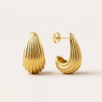 Ridged Teardrop Hoops: hypoallergenic hoop earrings, shown front and side on a soft stone background