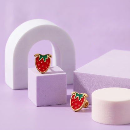 Strawberry Delight Flat Back Studs Gold styled on pastel blocks, front and side view