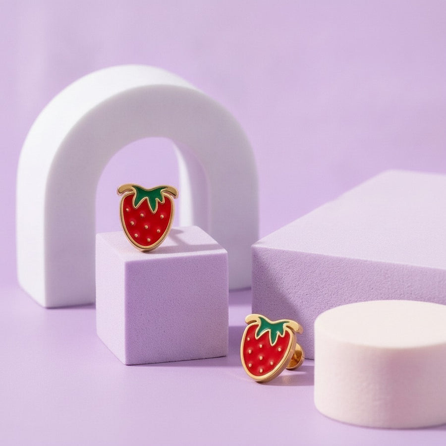 Strawberry Delight Flat Back Studs Gold styled on pastel blocks, front and side view