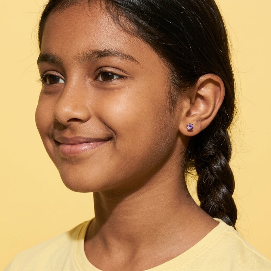 Birthstone Flat Back Studs Gold worn by a smiling girl