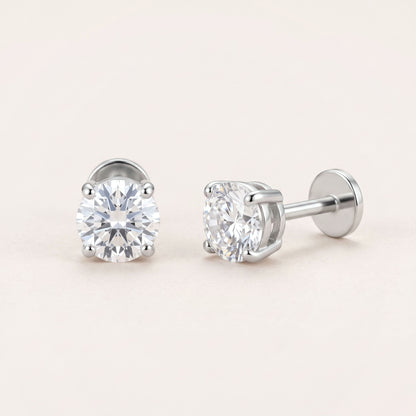 The Birthstone Flat Back Studs Silver in Diamond: hypoallergenic kids' flat back stud earrings, shown front and side on a soft stone background