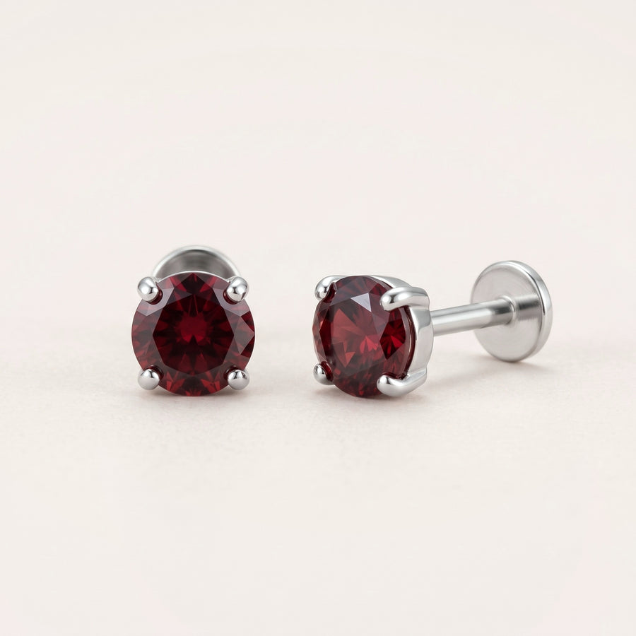 January birthstone earrings in silver: garnet colour flat back studs, front and side