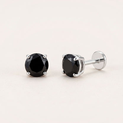 The Birthstone Flat Back Studs Silver in Onyx: hypoallergenic kids' flat back stud earrings, shown front and side on a soft stone background