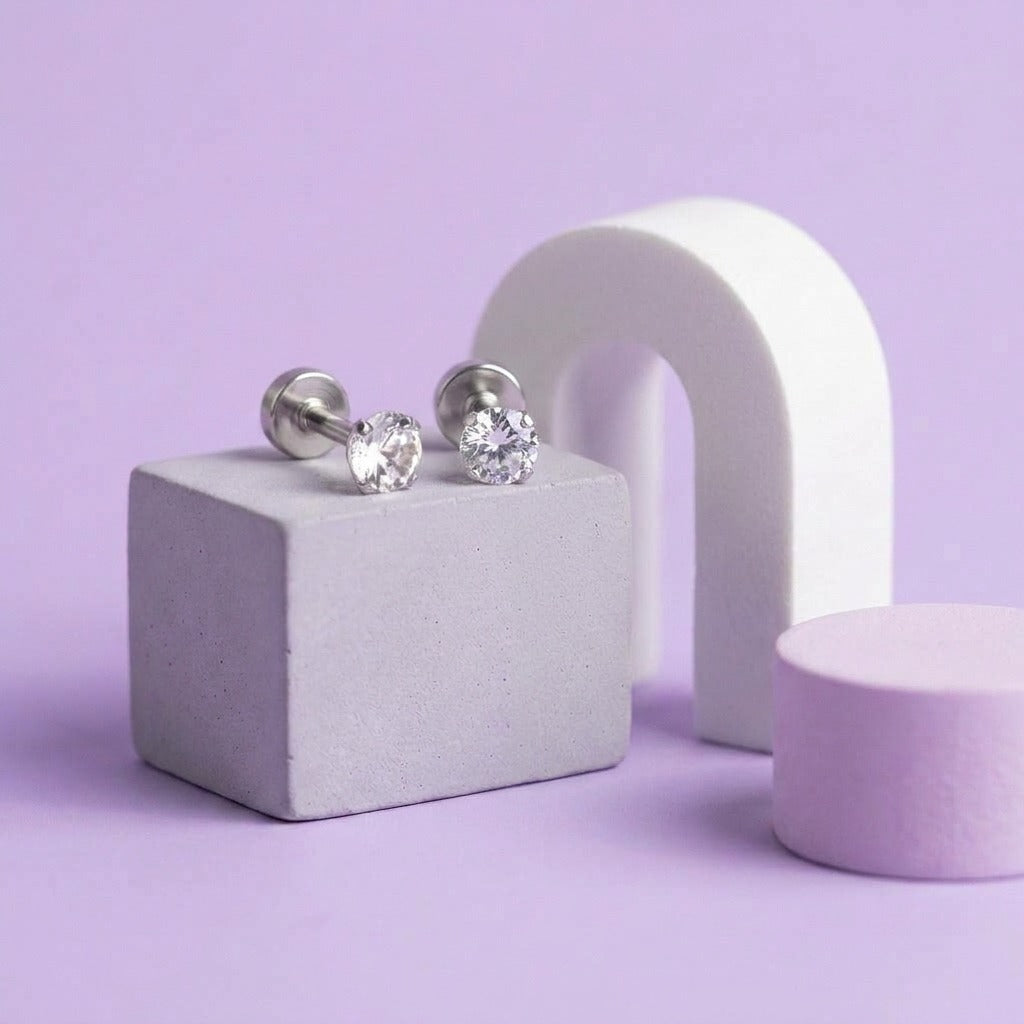 Birthstone Flat Back Studs Silver styled on pastel blocks, front and side view