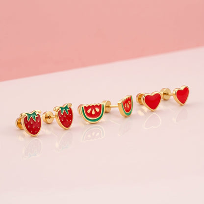 Strawberry Delight Flat Back Studs Gold + Watermelon Pop Flat Back Studs + Love Heart Flat Back Studs Gold: three hypoallergenic kids' earrings styled together on a soft background