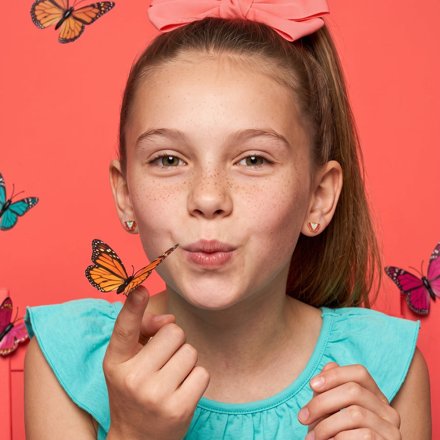 Vibrant Butterfly Flat Back Studs Gold worn by a smiling girl, bows butterflies look: hypoallergenic kids' earrings