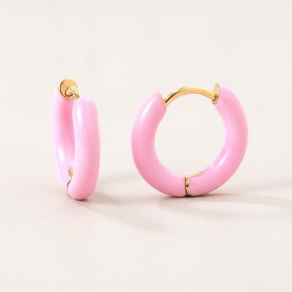 Enamel Pop Hoops Pink: hypoallergenic kids' huggie hoop earrings, shown front and side on a soft stone background