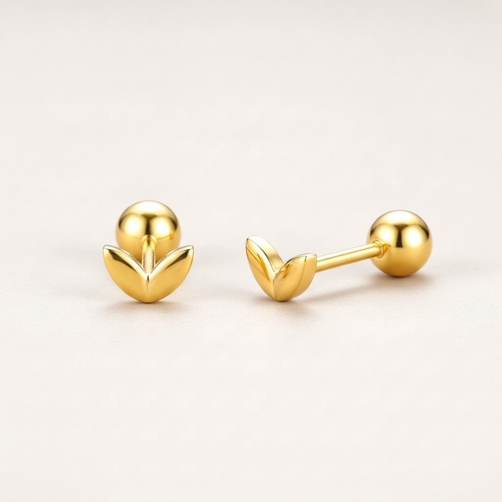 Mini Leaf Screw Back Studs Gold: hypoallergenic kids' screw back stud earrings, shown front and side on a soft stone background