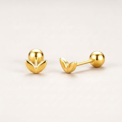 Mini Leaf Screw Back Studs Gold: hypoallergenic kids' screw back stud earrings, shown front and side on a soft stone background