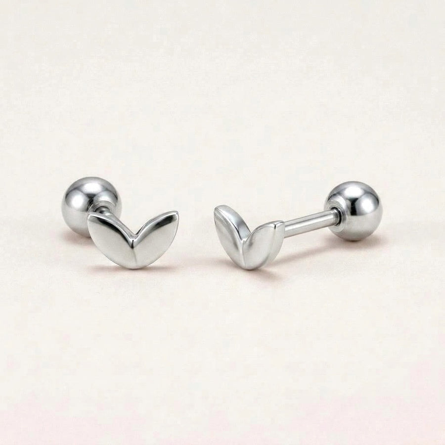 Mini Leaf Screw Back Studs Silver: hypoallergenic kids' screw back stud earrings, shown front and side on a soft stone background