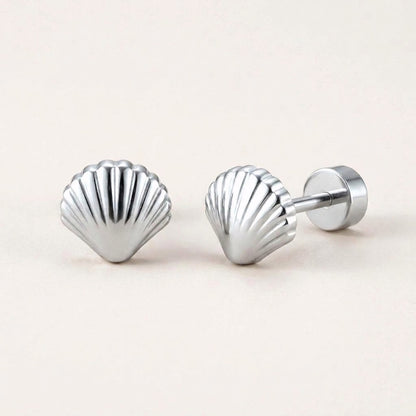 Seashell Flat Back Stud Silver: hypoallergenic kids' flat back stud earrings, shown front and side on a soft stone background
