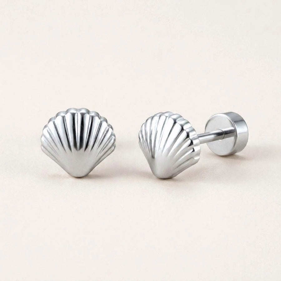 Seashell Flat Back Stud Silver: hypoallergenic kids' flat back stud earrings, shown front and side on a soft stone background