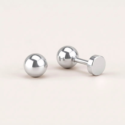 Simple Flat Back Studs Silver: hypoallergenic kids' flat back stud earrings, shown front and side on a soft stone background