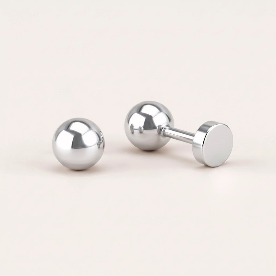 Simple Flat Back Studs Silver: hypoallergenic kids' flat back stud earrings, shown front and side on a soft stone background