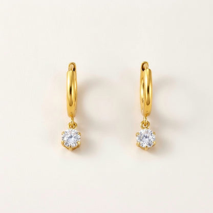 Twinkle CZ Diamond Huggies Gold: hypoallergenic kids' huggie hoop earrings, shown front and side on a soft stone background