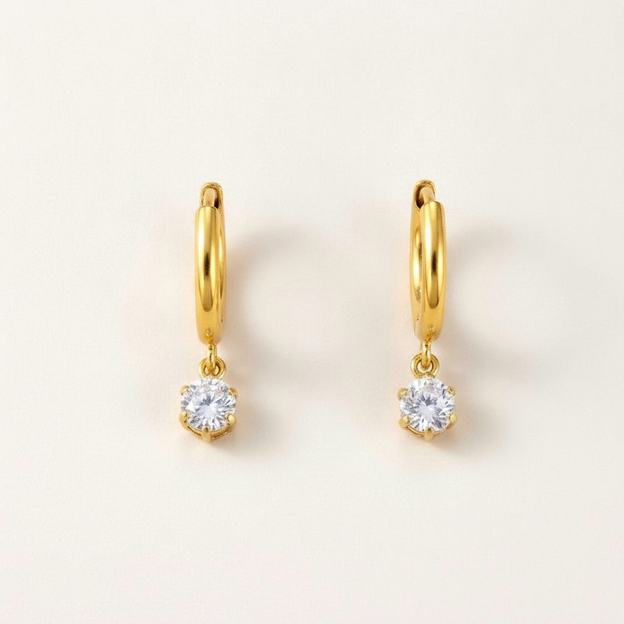 Twinkle CZ Diamond Huggies Gold: hypoallergenic kids' huggie hoop earrings, shown front and side on a soft stone background