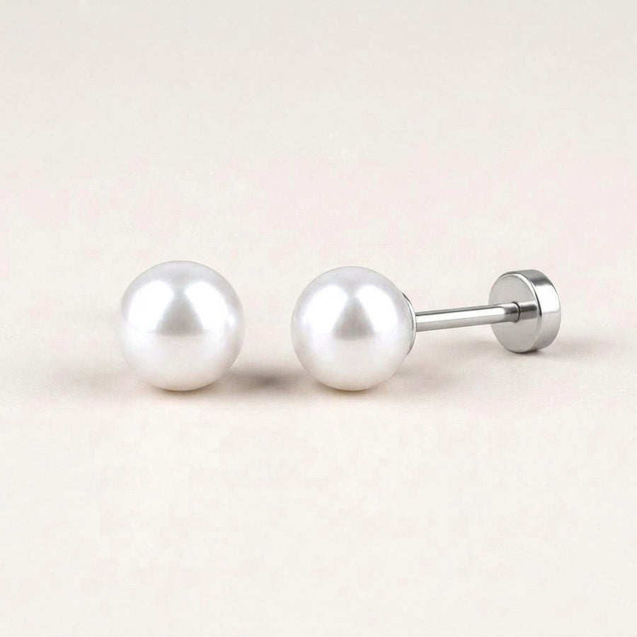 White Pearl Flat Back Studs Silver: hypoallergenic kids' flat back stud earrings, shown front and side on a soft stone background